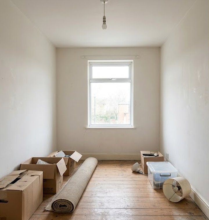 Empty room with moving boxes